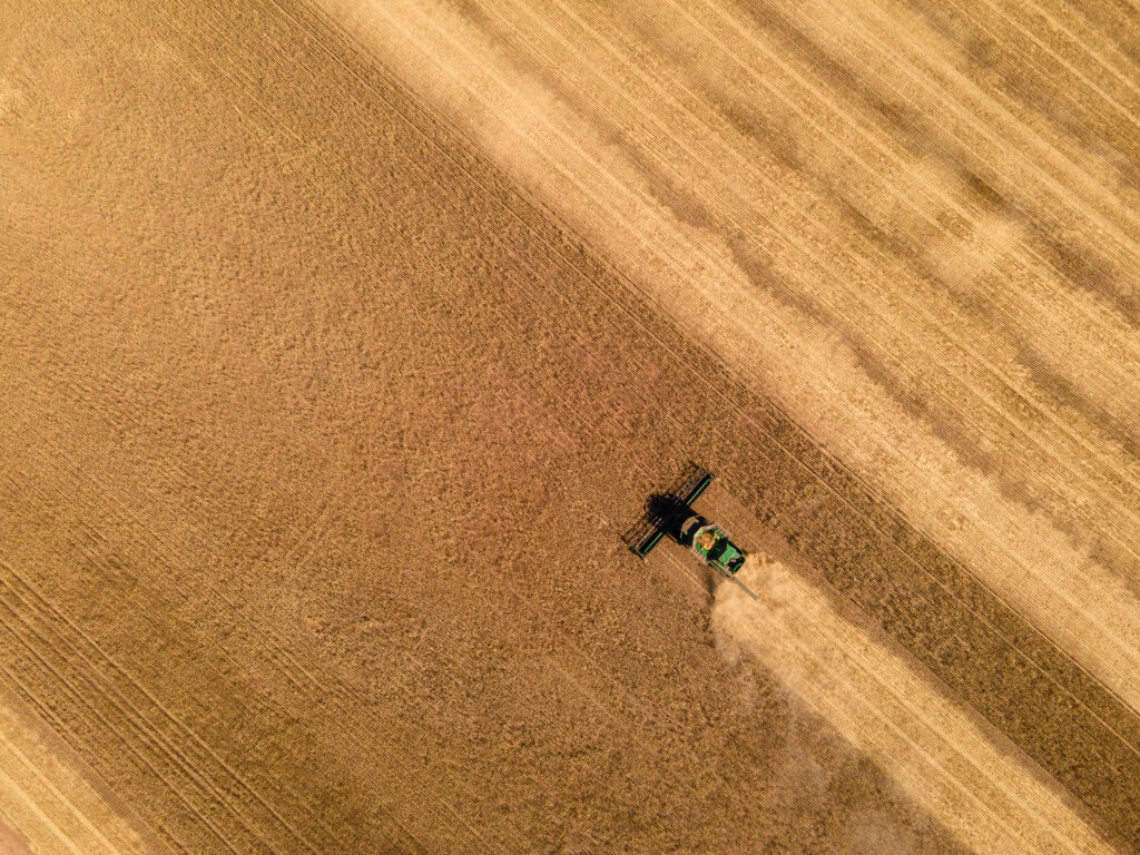 Harvester clearing a paddock after harvest